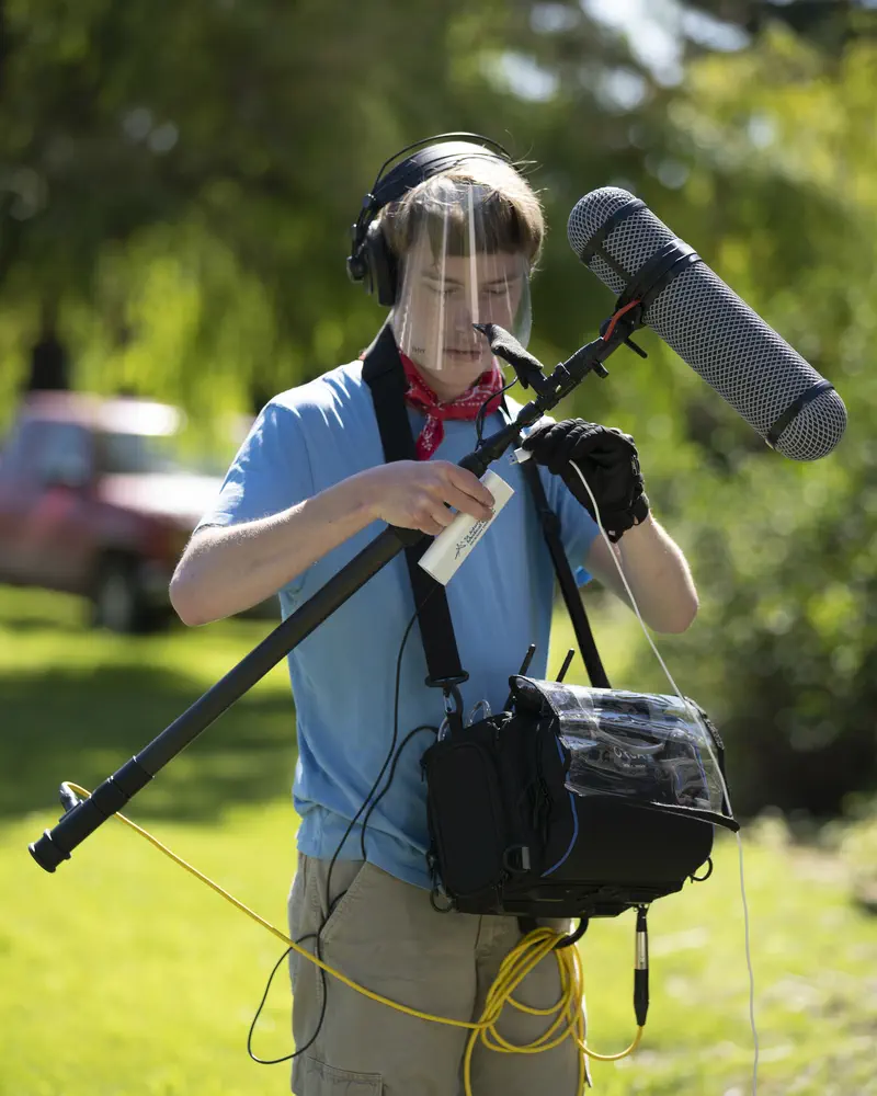 Peter Prestrud operating a boom microphone on location